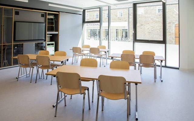 Image of the education room with tables and chairs