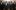 selma-ep2-pathe A group of men in suits walking down the street