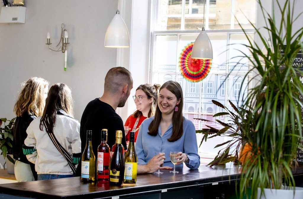 People stood at a bar